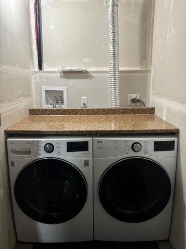 25 Redstone Path Ne, Calgary, AB - Indoor Photo Showing Laundry Room