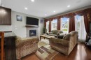 25 Redstone Path Ne, Calgary, AB  - Indoor Photo Showing Living Room With Fireplace 