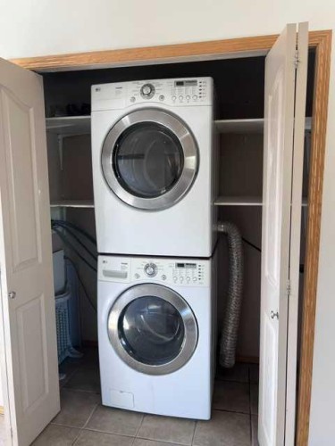 A-4813 49 Street West, Olds, AB - Indoor Photo Showing Laundry Room
