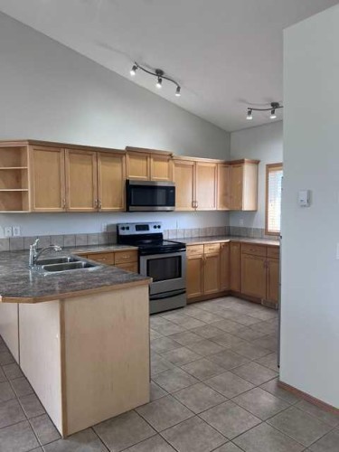 A-4813 49 Street West, Olds, AB - Indoor Photo Showing Kitchen With Double Sink