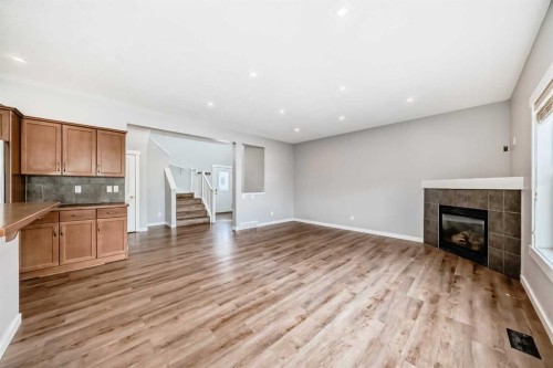 32 Copperleaf Way Se, Calgary, AB - Indoor With Fireplace