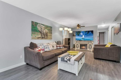 63 Elder Street, Red Deer, AB - Indoor Photo Showing Living Room With Fireplace