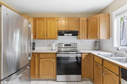 90 Coventry Lane Ne, Calgary, AB - Indoor Photo Showing Kitchen With Double Sink