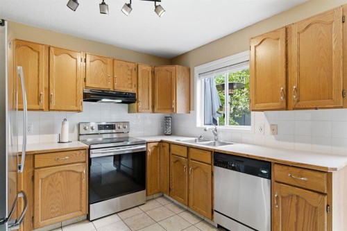 90 Coventry Lane Ne, Calgary, AB - Indoor Photo Showing Kitchen With Double Sink