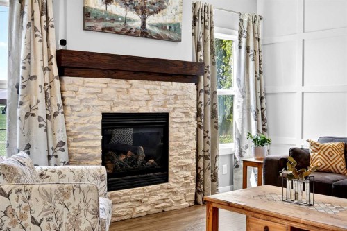 236 Aspenmere Circle, Chestermere, AB - Indoor Photo Showing Living Room With Fireplace