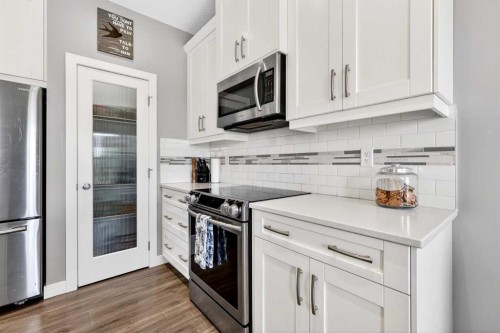 236 Aspenmere Circle, Chestermere, AB - Indoor Photo Showing Kitchen With Upgraded Kitchen