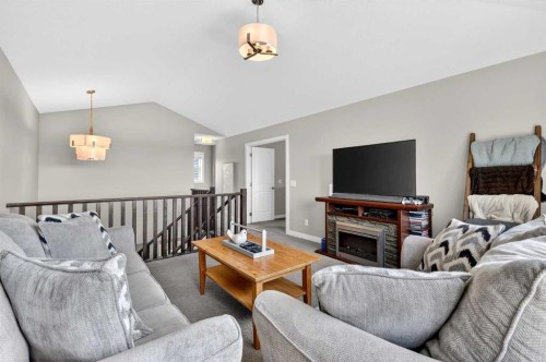 236 Aspenmere Circle, Chestermere, AB - Indoor Photo Showing Living Room With Fireplace