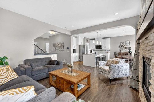 236 Aspenmere Circle, Chestermere, AB - Indoor Photo Showing Living Room With Fireplace