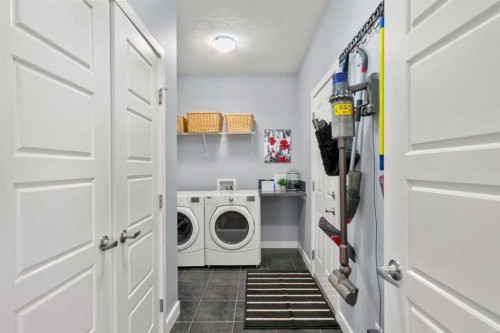 25 Fireside Landing, Cochrane, AB - Indoor Photo Showing Laundry Room