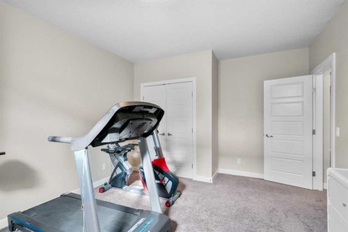 25 Fireside Landing, Cochrane, AB - Indoor Photo Showing Gym Room