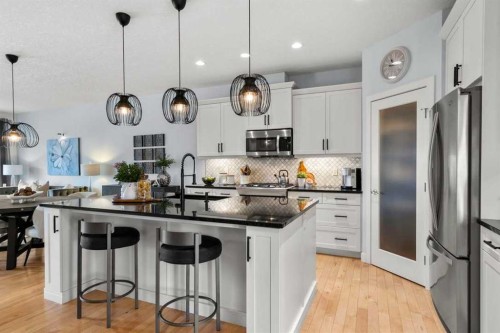 25 Fireside Landing, Cochrane, AB - Indoor Photo Showing Kitchen With Upgraded Kitchen
