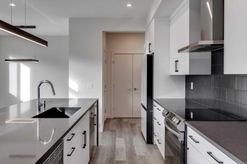 64 Waterford Terrace, Chestermere, AB - Indoor Photo Showing Kitchen With Upgraded Kitchen