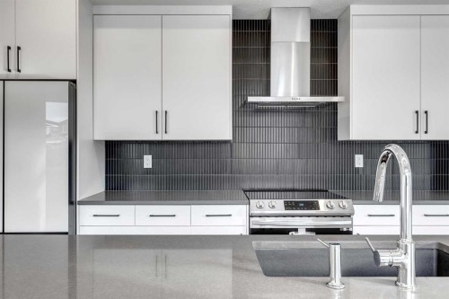 64 Waterford Terrace, Chestermere, AB - Indoor Photo Showing Kitchen With Upgraded Kitchen