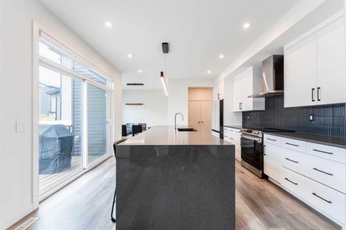 64 Waterford Terrace, Chestermere, AB - Indoor Photo Showing Kitchen With Upgraded Kitchen
