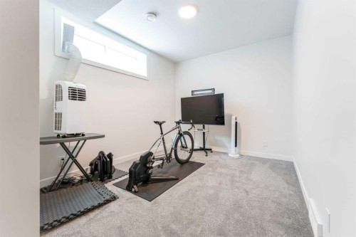 64 Waterford Terrace, Chestermere, AB - Indoor Photo Showing Gym Room