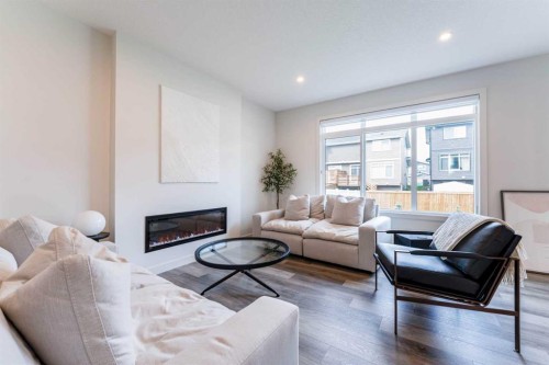 64 Waterford Terrace, Chestermere, AB - Indoor Photo Showing Living Room With Fireplace