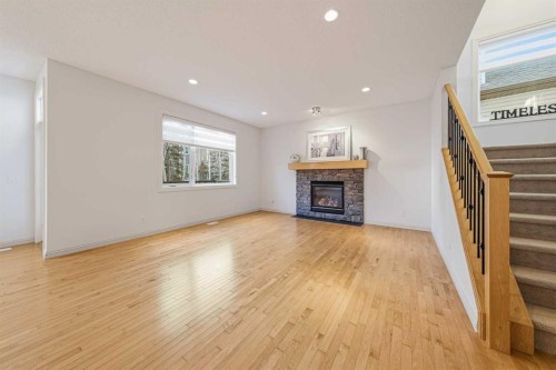 109 Silverado Creek Crescent Sw, Calgary, AB - Indoor Photo Showing Living Room With Fireplace