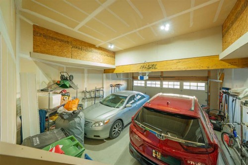109 Silverado Creek Crescent Sw, Calgary, AB - Indoor Photo Showing Garage