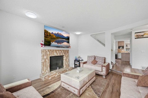 172 Castlebrook Road Ne, Calgary, AB - Indoor Photo Showing Living Room With Fireplace