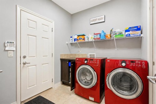 16 Sunset Terrace, Cochrane, AB - Indoor Photo Showing Laundry Room