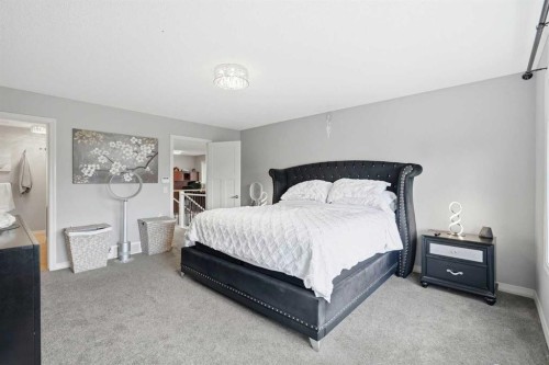 16 Sunset Terrace, Cochrane, AB - Indoor Photo Showing Bedroom