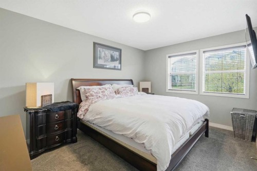 16 Sunset Terrace, Cochrane, AB - Indoor Photo Showing Bedroom