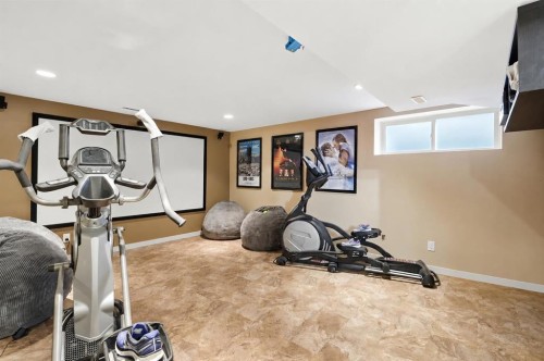 16 Sunset Terrace, Cochrane, AB - Indoor Photo Showing Gym Room