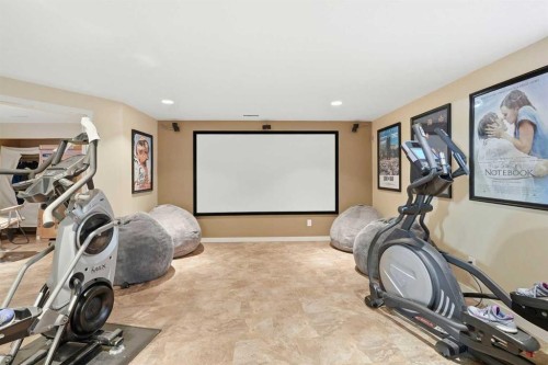 16 Sunset Terrace, Cochrane, AB - Indoor Photo Showing Gym Room