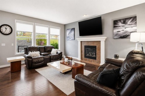 16 Sunset Terrace, Cochrane, AB - Indoor Photo Showing Living Room With Fireplace