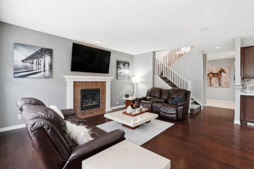 16 Sunset Terrace, Cochrane, AB - Indoor Photo Showing Living Room With Fireplace