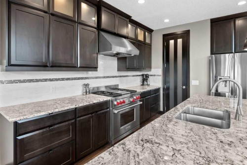 29 Quarry Court Se, Calgary, AB - Indoor Photo Showing Kitchen With Double Sink With Upgraded Kitchen