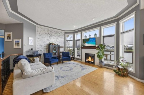 23 Lake Ridge, Olds, AB - Indoor Photo Showing Living Room With Fireplace