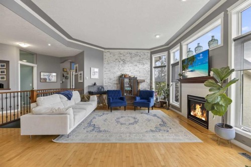 23 Lake Ridge, Olds, AB - Indoor Photo Showing Living Room With Fireplace