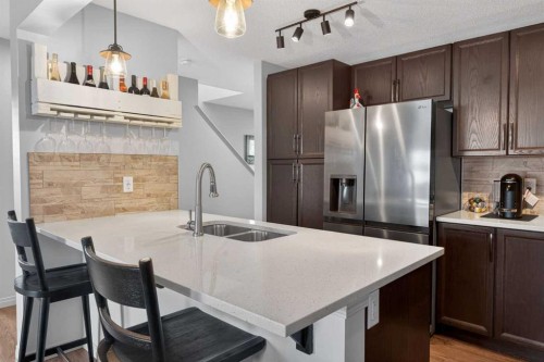 183 Copperpond Street Se, Calgary, AB - Indoor Photo Showing Kitchen With Double Sink With Upgraded Kitchen