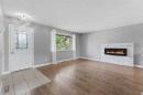 819 Avonlea Place Se, Calgary, AB  - Indoor Photo Showing Living Room With Fireplace 