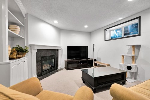 9 Chaparral Villas Se, Calgary, AB - Indoor Photo Showing Living Room With Fireplace