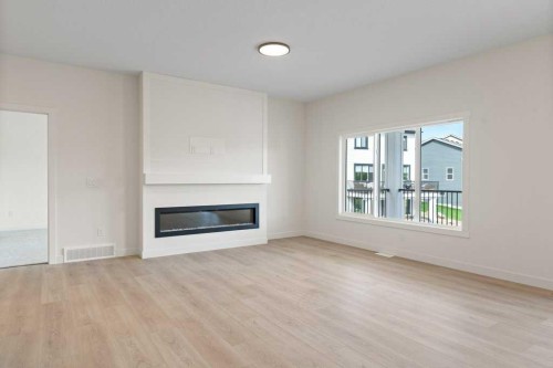 206 Monterey Bay Se, High River, AB - Indoor Photo Showing Living Room With Fireplace
