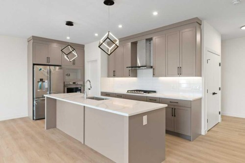 206 Monterey Bay Se, High River, AB - Indoor Photo Showing Kitchen With Double Sink With Upgraded Kitchen