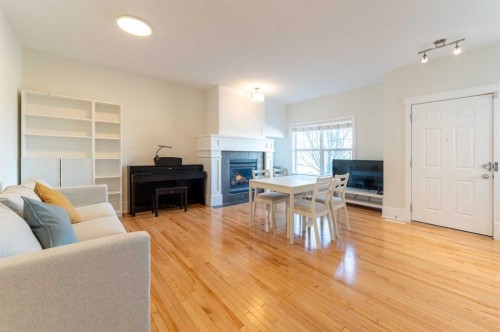 1024 Wentworth Rise Sw, Calgary, AB - Indoor Photo Showing Living Room With Fireplace