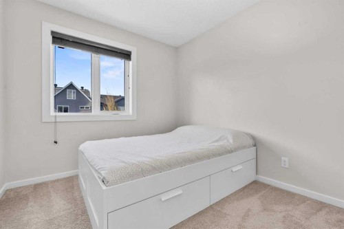 567 Evansborough Way Nw, Calgary, AB - Indoor Photo Showing Bedroom