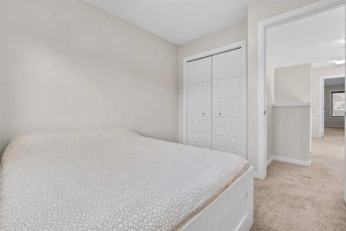 567 Evansborough Way Nw, Calgary, AB - Indoor Photo Showing Bedroom
