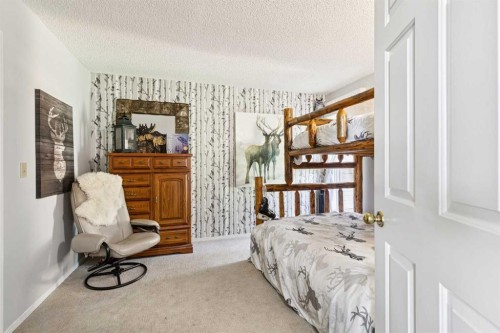 36 Cummer Place, Bragg Creek, AB - Indoor Photo Showing Bedroom