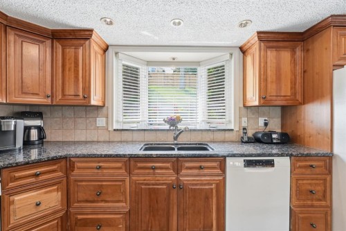 5807 Coach Hill Road Sw, Calgary, AB - Indoor Photo Showing Kitchen With Double Sink