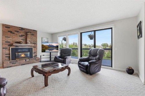 5807 Coach Hill Road Sw, Calgary, AB - Indoor Photo Showing Living Room With Fireplace