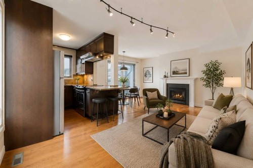 10-123 13 Avenue Ne, Calgary, AB - Indoor Photo Showing Living Room With Fireplace
