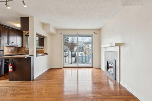 10-123 13 Avenue Ne, Calgary, AB - Indoor Photo Showing Kitchen With Fireplace