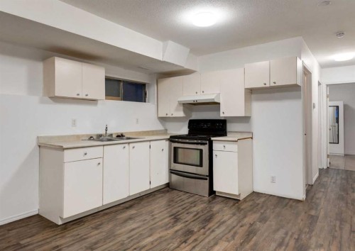 1135 37 Street Se, Calgary, AB - Indoor Photo Showing Kitchen With Double Sink