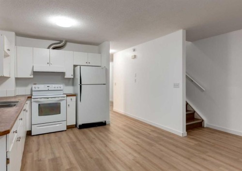 1135 37 Street Se, Calgary, AB - Indoor Photo Showing Kitchen With Double Sink
