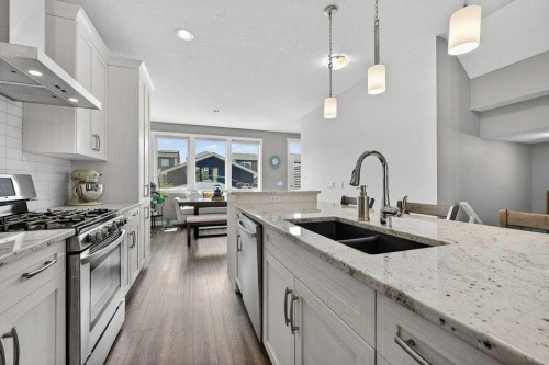 271 Fireside Drive, Cochrane, AB - Indoor Photo Showing Kitchen With Double Sink With Upgraded Kitchen