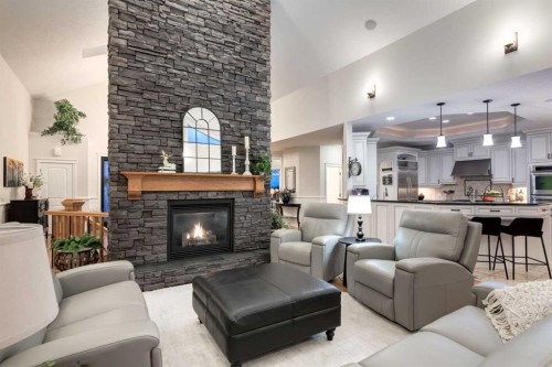 100-274256 272 Street West, Rural Foothills County, AB - Indoor Photo Showing Living Room With Fireplace